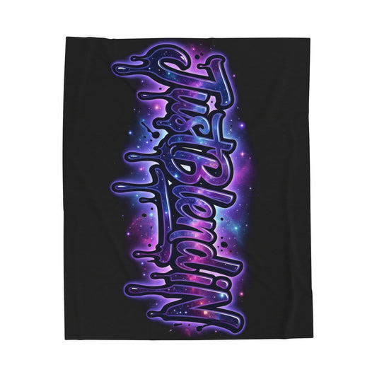 A black rectangular blanket or towel featuring a large vertical graphic with the words 'Just Blending' in stylized purple and blue neon lettering against a galaxy-like background.